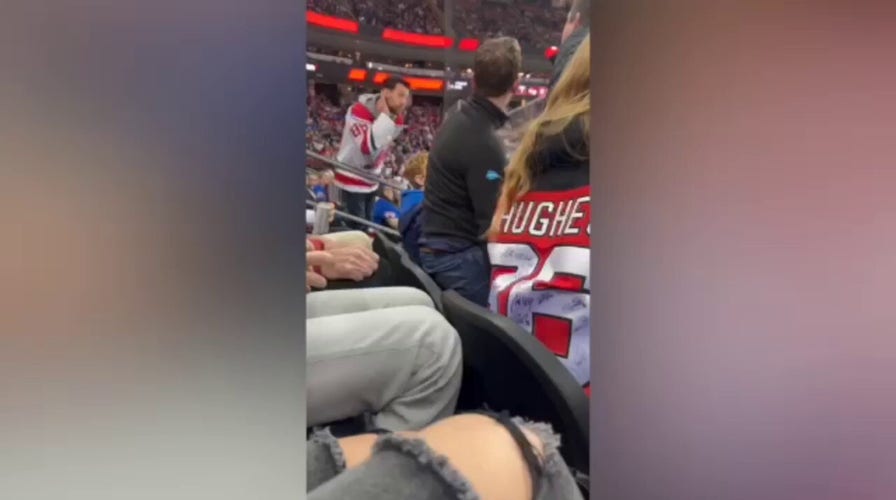New Jersey Devils fan headbutts New York Rangers fan