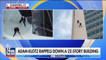 Adam Klotz rappels down 22-story building