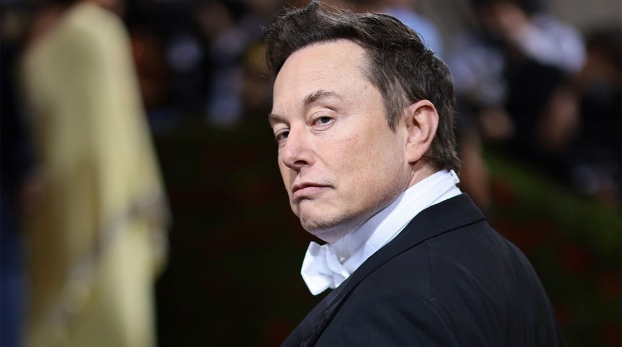 Elon Musk captured looking at the camera during an event.
