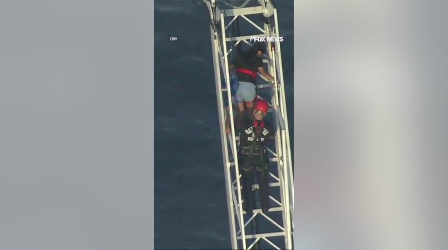 Roller coaster riders rescued after ride STALLS 100 feet above ground