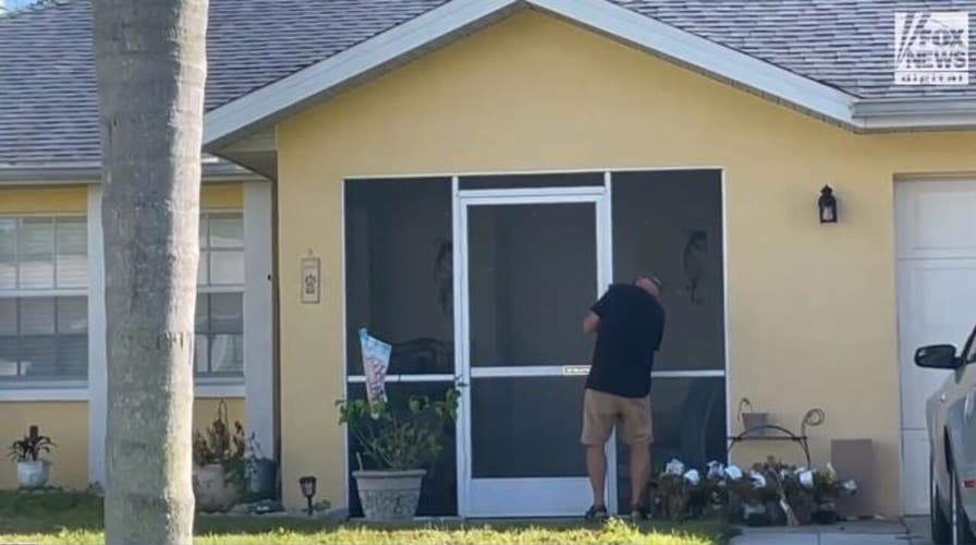 Chris Laundrie spotted installing what appears to be video doorbell and picking up mail at his Florida home