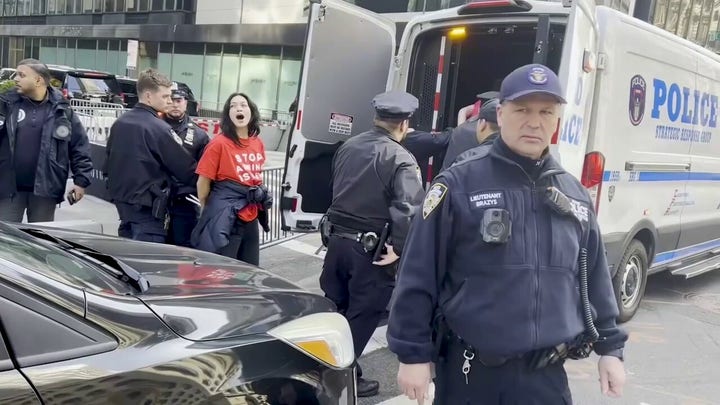 Police haul away protesters outside Trump Tower