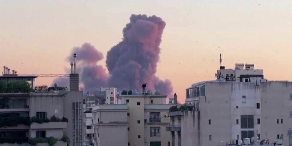 Israeli strike on Hezbollah headquarters in Beirut seen from across city