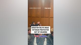 Senator helps DRAG veteran protester out of hearing