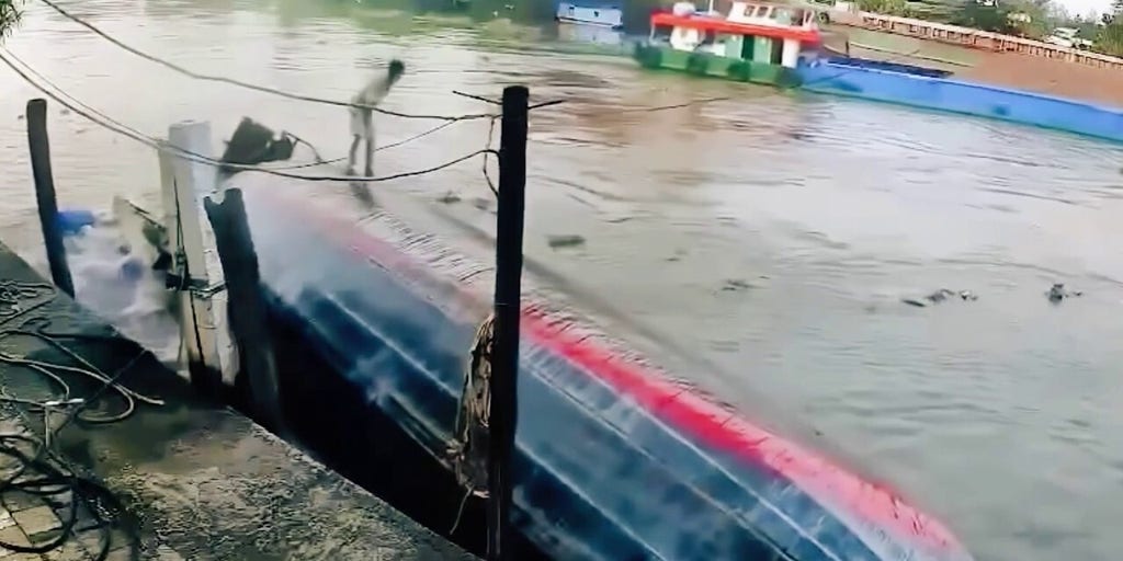 Barge carrying bricks capsizes as fast-footed worker scurries to safety