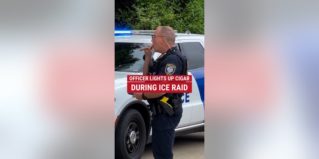 A DHS officer was spotted smoking a cigar during an ICE raid