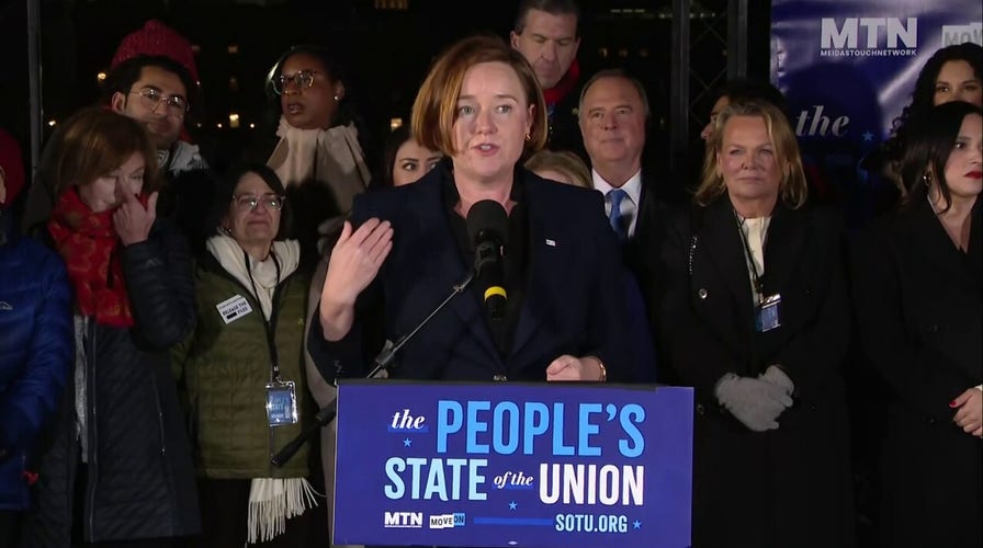 Trump critics and Dem lawmakers stand in below freezing temps protesting SOTU