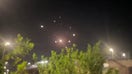 Israeli air defenses intercepting Iranian missiles
