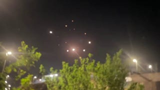 Israeli air defenses intercepting Iranian missiles
