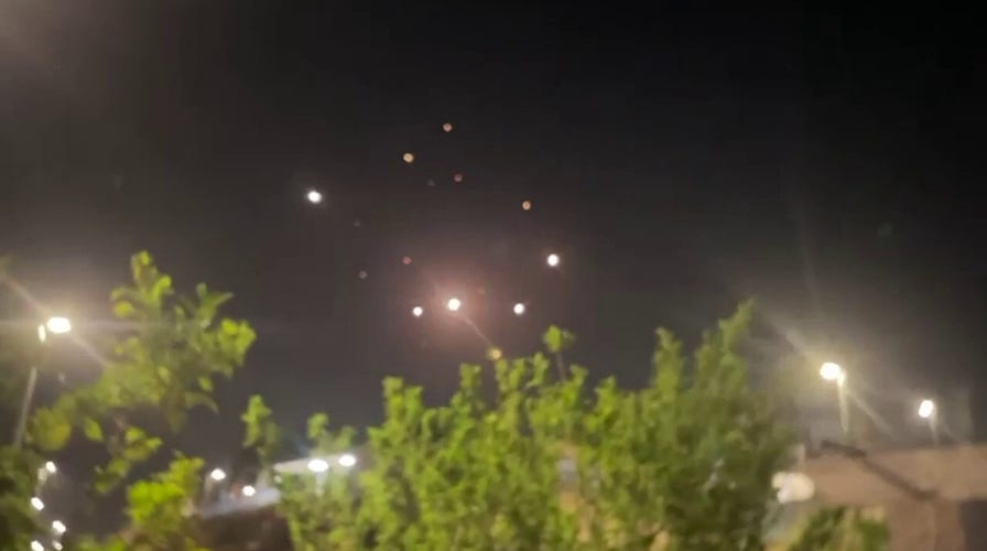 Israeli air defenses intercepting Iranian missiles