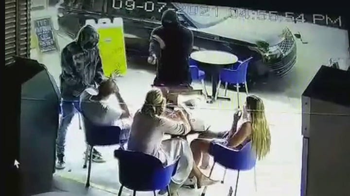 Diners robbed at gunpoint at Los Angeles sidewalk café.