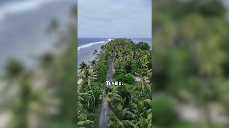 Couple walks across one of the world's smallest countries