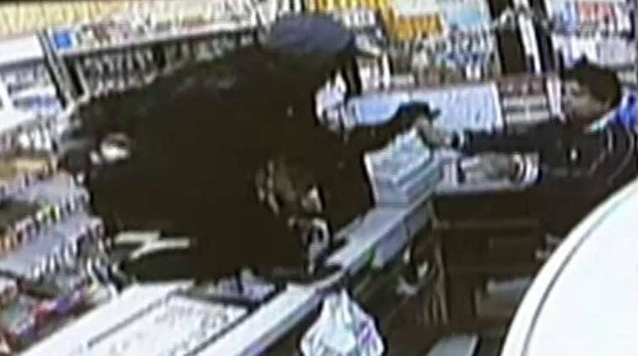 Clerk duels armed robber with knife