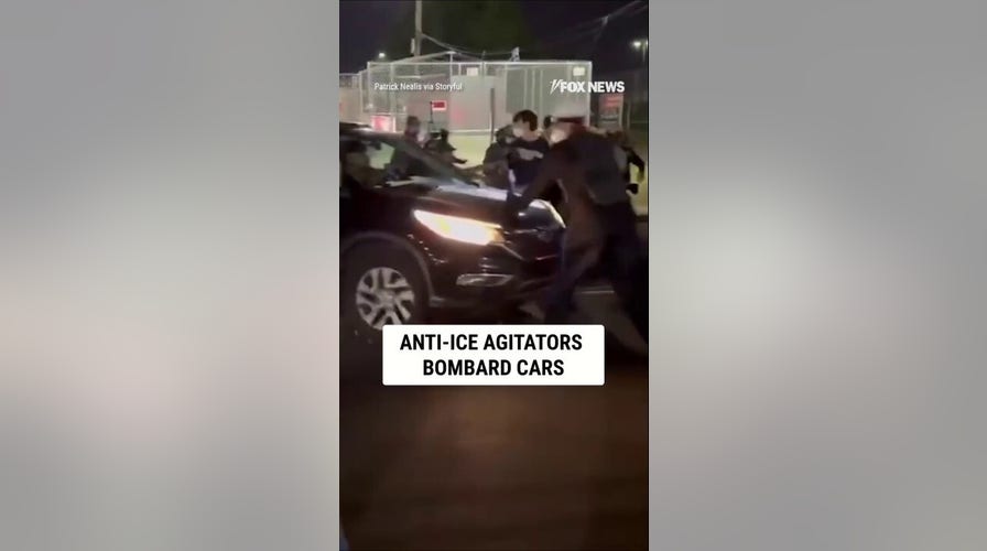 Anti-ICE agitators CONFRONT vehicles leaving ICE facility