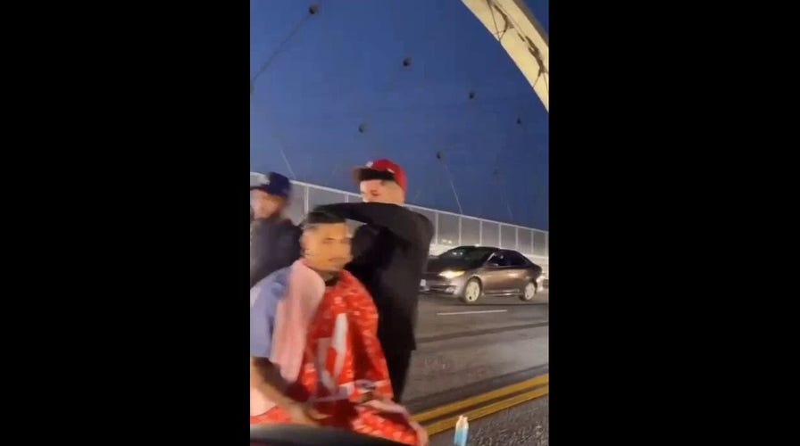 Man gets haircut in traffic on newly opened Los Angeles bridge 