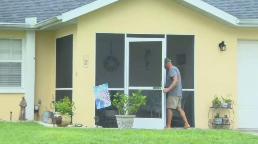 Brian Laundrie's father, Christopher, picks up his mail Saturday afternoon