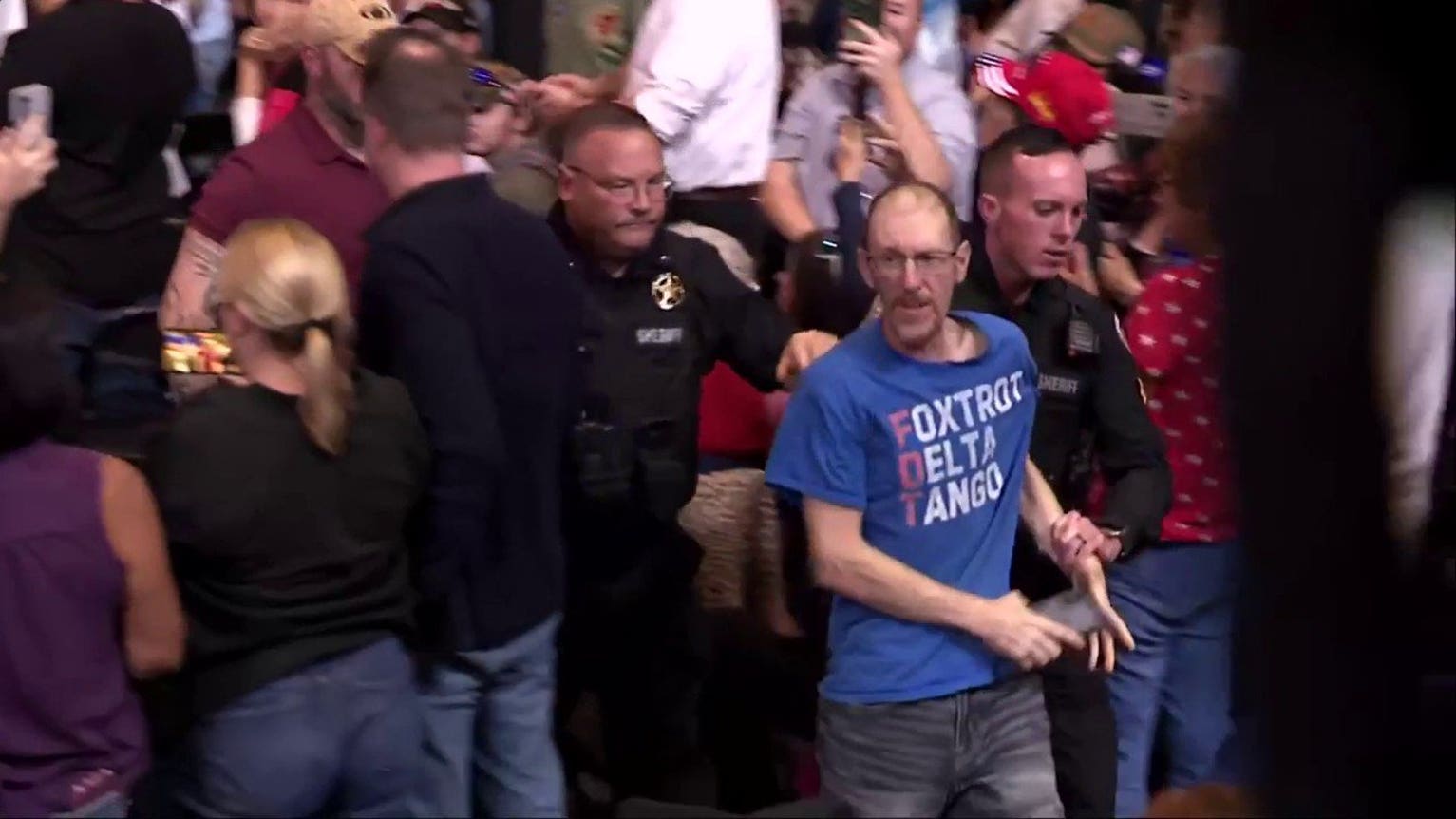 Trump pauses midterm rally after punch thrown in crowd