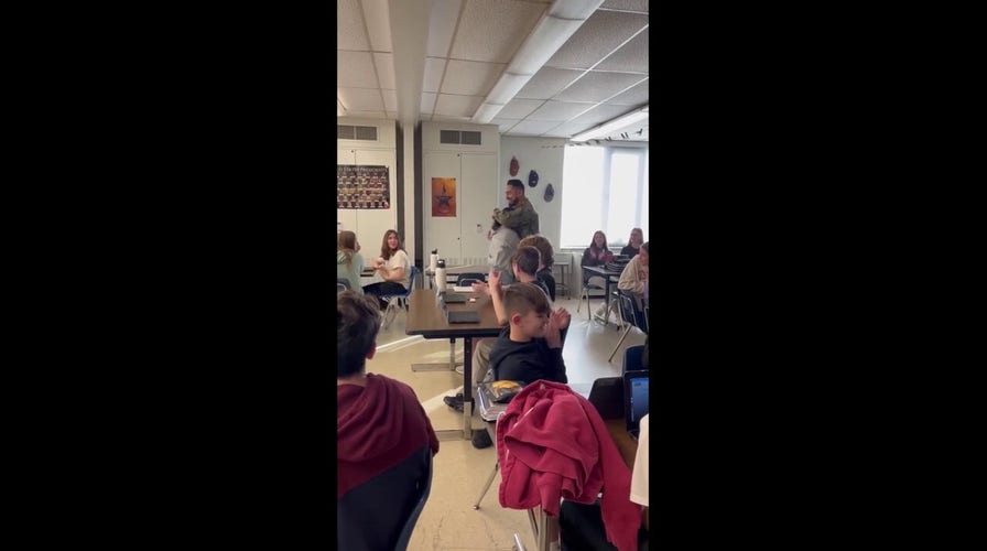 Siblings reunite as brother returns from the Navy to surprise his younger sister