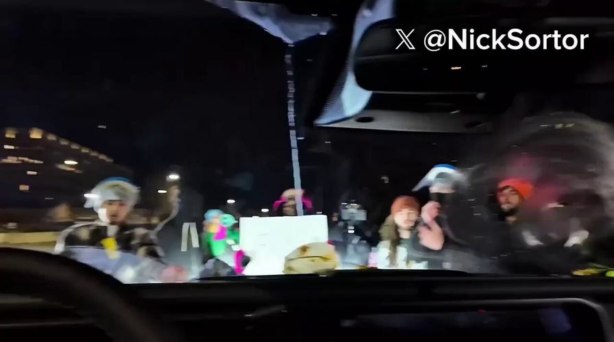 Anti-ICE agitators swarm conveyance  of blimpish  influencer Nick Sortor