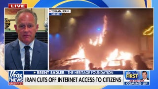 Iran cuts off internet access to citizens as protesters set fires in Tehran