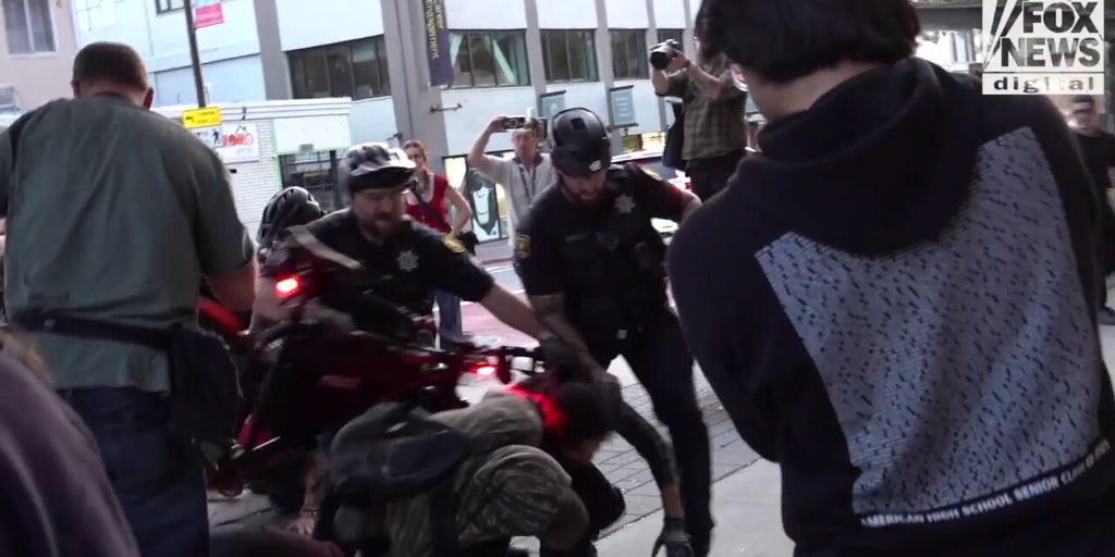 Fight breaks out as agitators stage protest outside TPUSA event