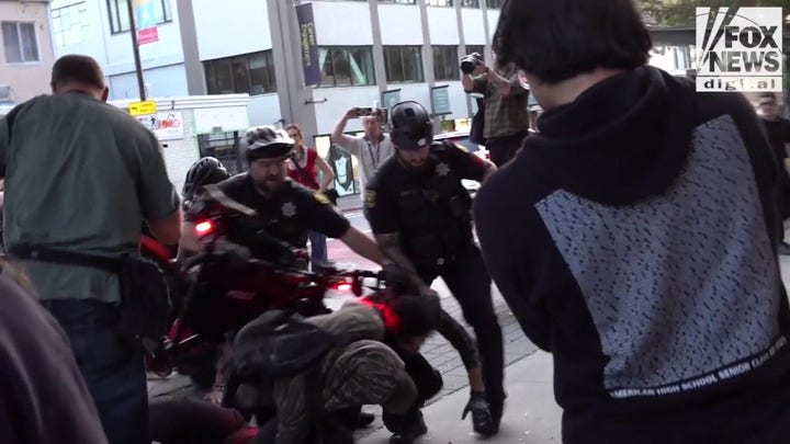 Fight breaks out as agitators stage protest outside TPUSA event