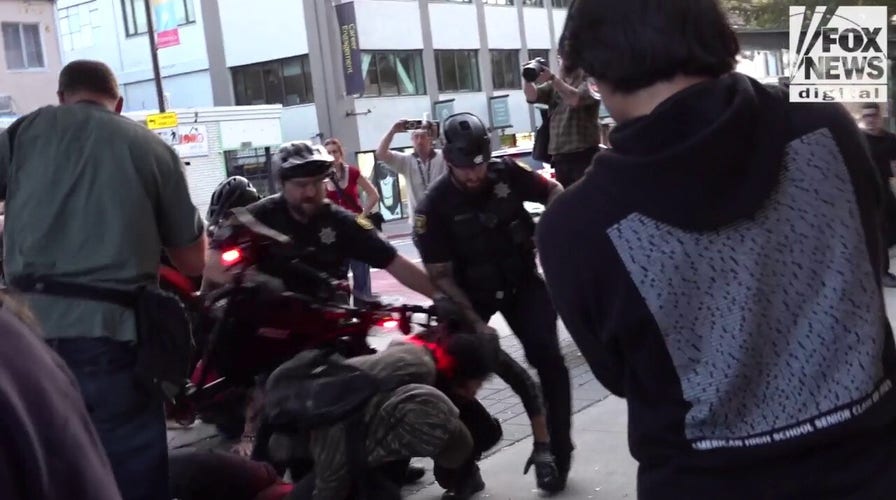 Fight breaks retired  arsenic  agitators signifier    protestation  extracurricular  TPUSA event