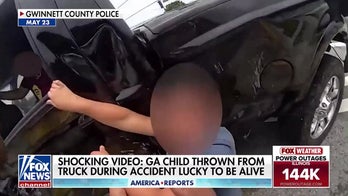 Police dashcam captures moment child is ejected from truck during crash