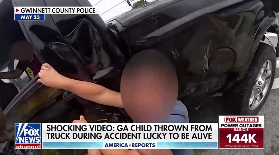 Police dashcam captures moment child is ejected from truck during crash