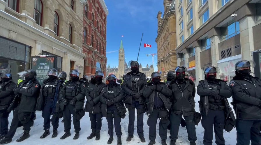 Police watch 'Freedom Convoy' protests in Ottawa