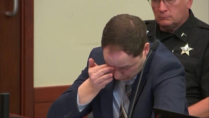Brendan Banfield visibly emotional as police video of wife's death played for jury