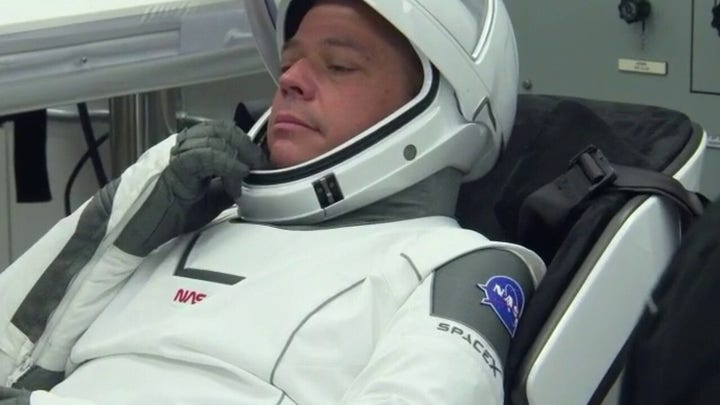 NASA astronauts suit up for history-making mission