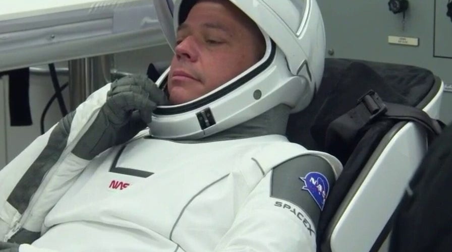 NASA astronauts suit up for history-making mission 