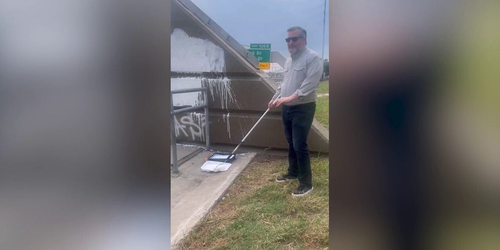 Cruz paints over “F--- Charlie Kirk” graffiti near Houston highway bridge