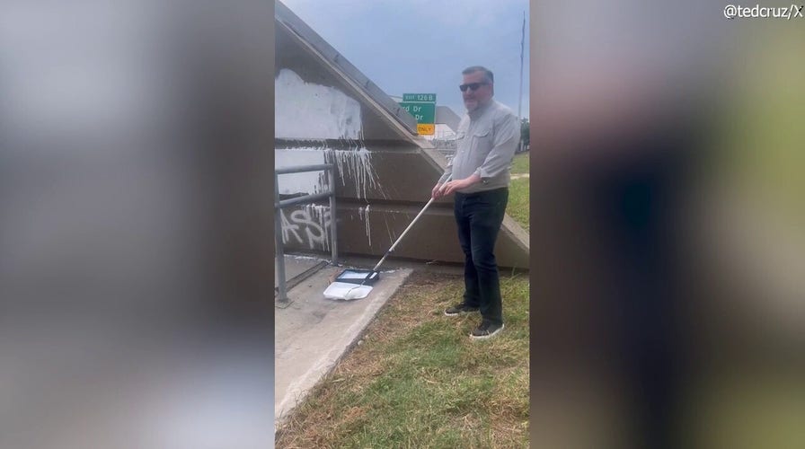 Cruz paints over “F--- Charlie Kirk” graffiti near Houston highway bridge