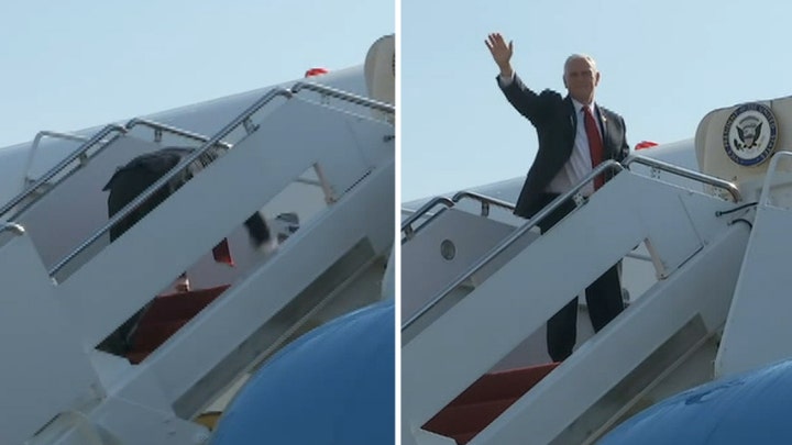 Pence stumbles climbing stairs to Air Force Two