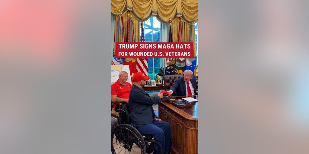 Trump signs MAGA hats for wounded U.S. veterans