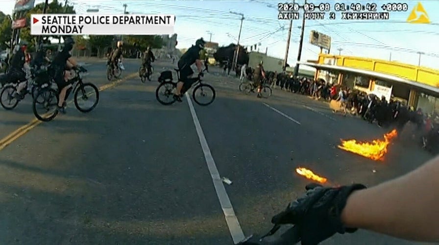 Seattle police form human barricade outside headquarters