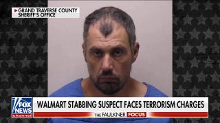 Suspect faces terrorism charges after stabbing 11 at a Michigan Walmart