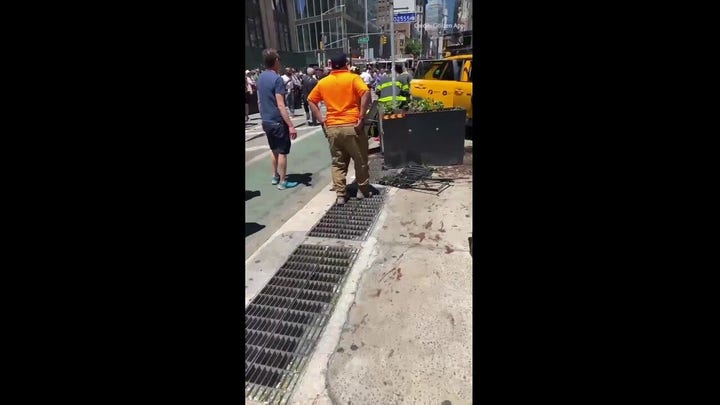 NYC taxi crashes into building with pedestrians on the sidewalk
