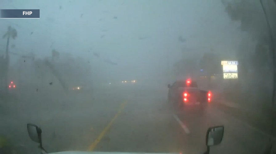 Truck caught in suspected tornado flips on its side in Florida
