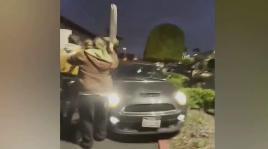 Striking Medieval Times workers nearly driven over by car in California: video