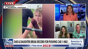 Father, daughter break record for pushing a car one mile