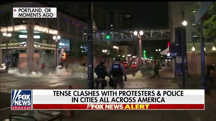 Police clash with protesters in Portland, Oregon