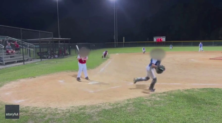 Parent films youth baseball game as shots are fired