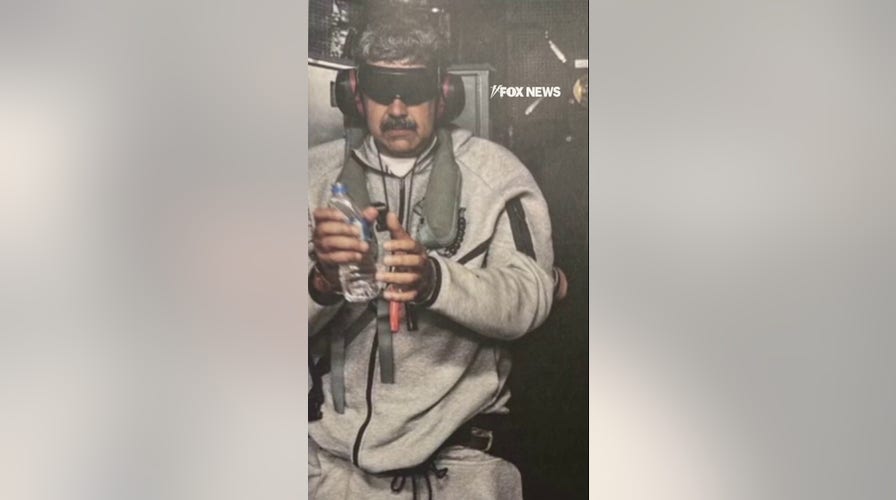  Trump shares photograph  of Maduro aboard USS Iwo Jima