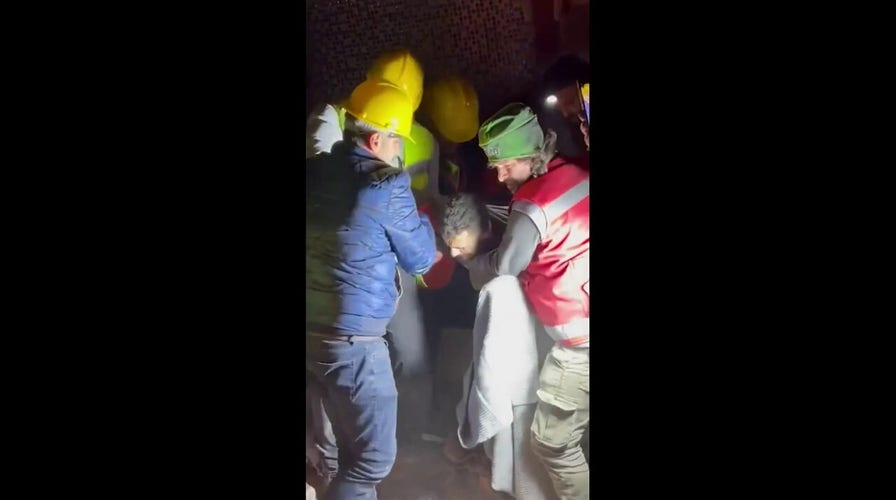 Turkey earthquake survivor is pulled out from underneath rubble