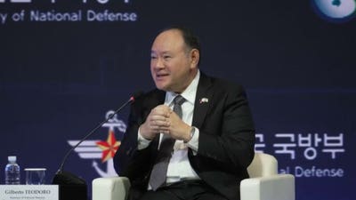 Philippines defense chief unloads on China after being handed note on stage