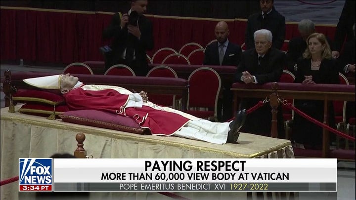 Pope Emeritus Benedict XVl lies in state as thousands of mourners pay tribute