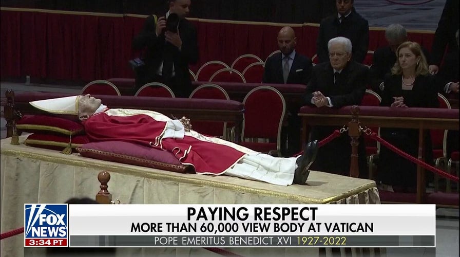 Pope Emeritus Benedict XVl lies in state as thousands of mourners pay tribute